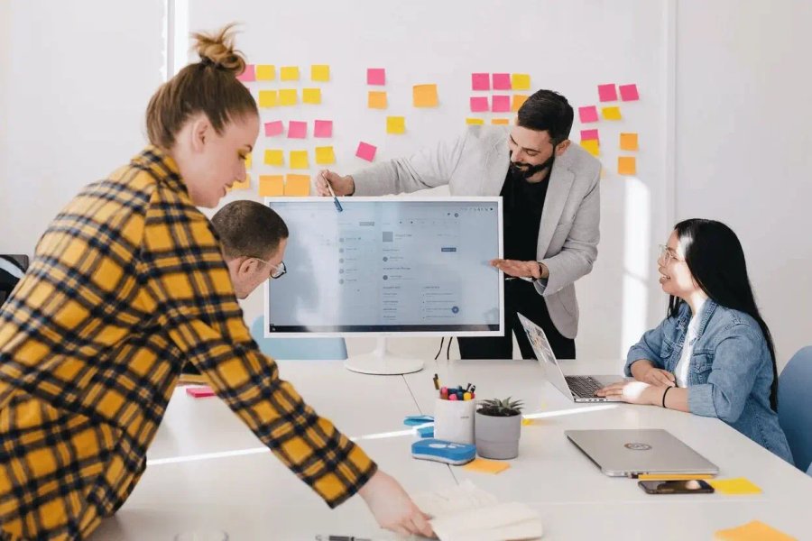 Team reviewing data on a screen during a meeting